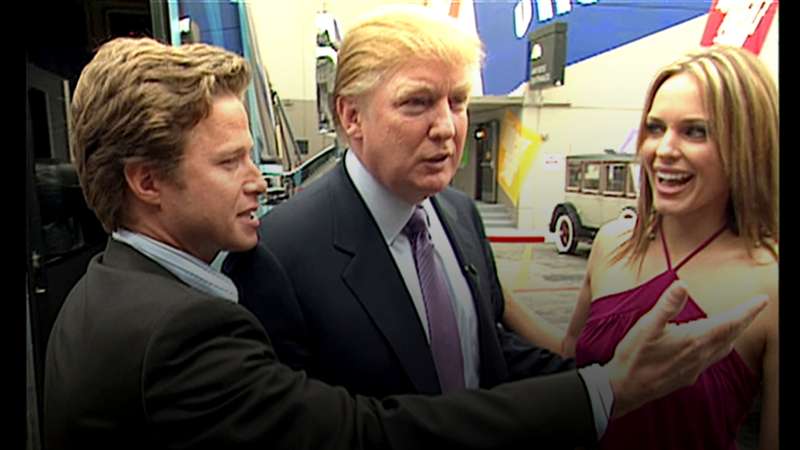 In this 2005 frame from video, Donald Trump (center)prepares for an appearance on 'Days of Our Lives' with actress Arianne Zucker (right). He is accompanied to the set by Access Hollywood host Billy Bush (left).