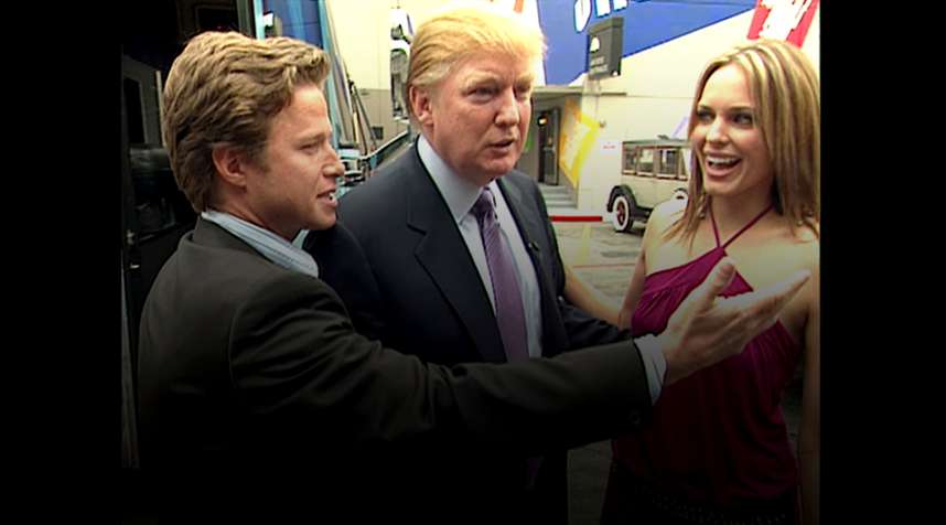 In this 2005 frame from video, Donald Trump (center)prepares for an appearance on 'Days of Our Lives' with actress Arianne Zucker (right). He is accompanied to the set by Access Hollywood host Billy Bush (left).