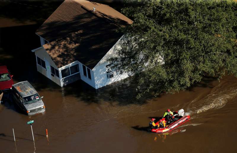 A swift water rescue team is seen making its way through a flooded area after Hurricane Matthew in Lumberton, North Carolina October 10, 2016.