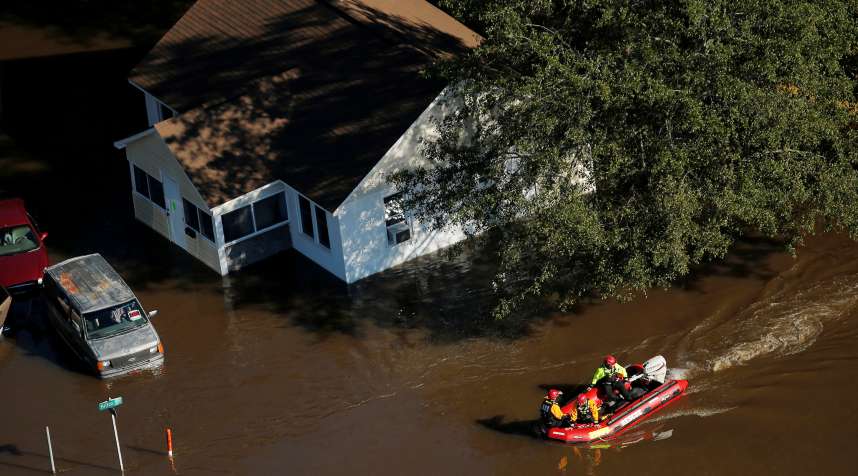 A swift water rescue team is seen making its way through a flooded area after Hurricane Matthew in Lumberton, North Carolina October 10, 2016.