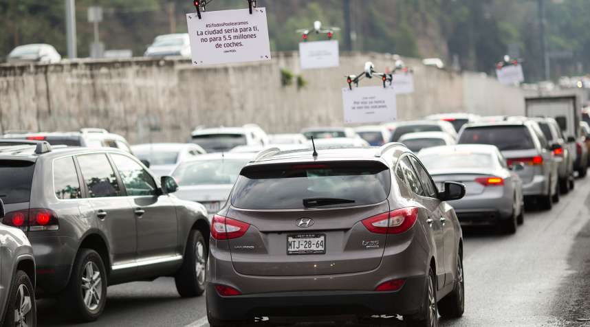 Uber Technologies Inc. drones advertise uberPOOL above traffic on a highway in Mexico City, Mexico, on Friday, June 17, 2016.