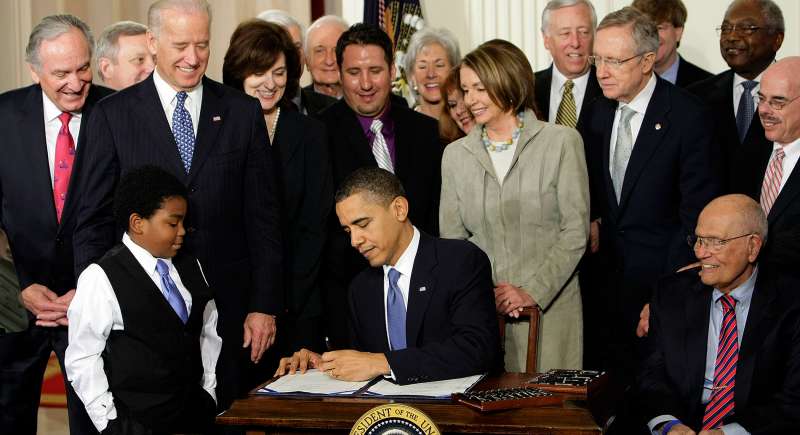 In this March 23, 2010 file photo, President Barack Obama signs the health care bill in the East Room of the White House in Washington.