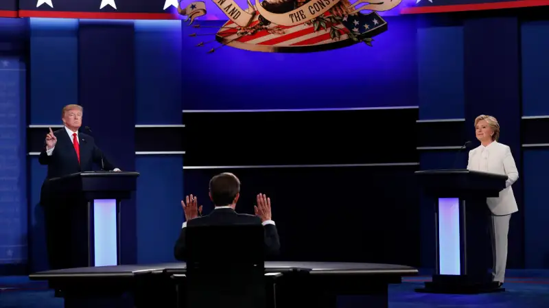 Republican U.S. presidential nominee Donald Trump and Democratic U.S. presidential nominee Hillary Clinton take part in their third and final 2016 presidential campaign debate, moderated by Chris Wallace (C), at UNLV in Las Vegas, Nevada, U.S., October 19, 2016.