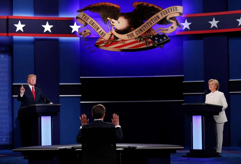 Republican U.S. presidential nominee Donald Trump and Democratic U.S. presidential nominee Hillary Clinton take part in their third and final 2016 presidential campaign debate, moderated by Chris Wallace (C), at UNLV in Las Vegas, Nevada, U.S., October 19, 2016.