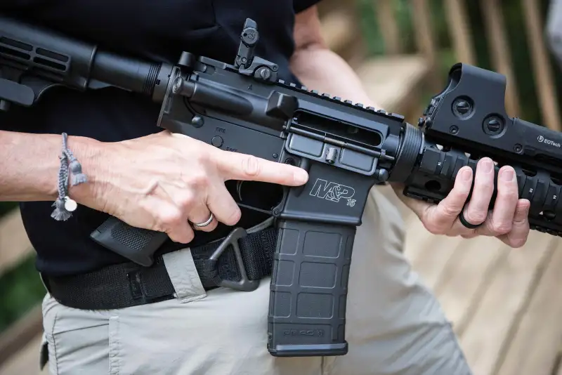 In this photo taken June 23, 2016, a Smith & Wesson M&P15 is held in Auburn, Georgia.