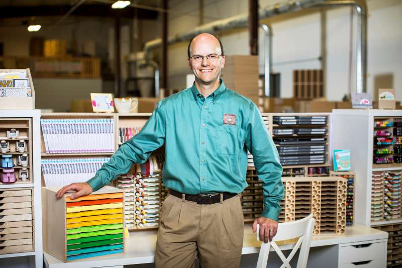 Brett Haugen stands with his craft storage products at Stamp-n-Storage in Hutchinson, Minn., on Sunday, Sept. 18, 2016. 
            
            Photo by Ackerman + Gruber
            @ackermangruber