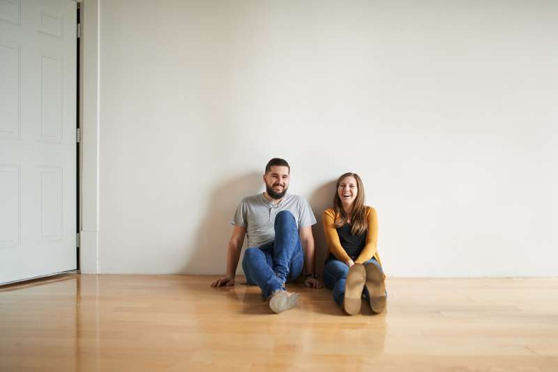 Shot of a loving couple sitting on the floor