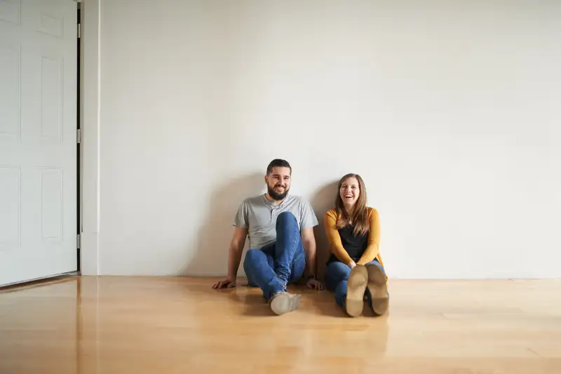 Shot of a loving couple sitting on the floor