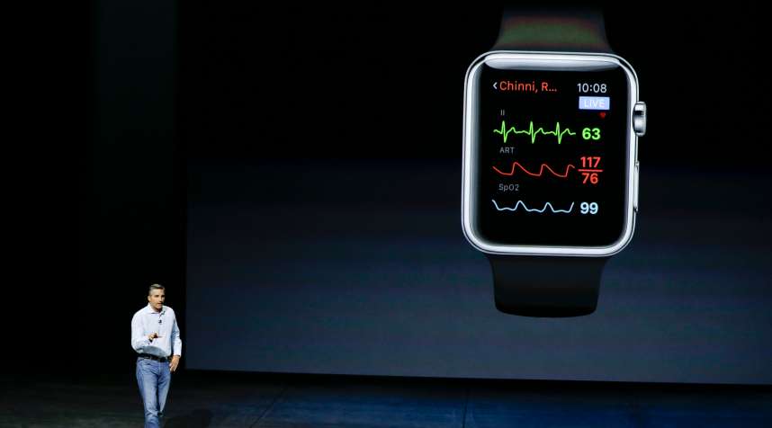 Dr. Cameron Powell with Airstrip, talks about health monitor options on the Apple Watch during the Apple event at the Bill Graham Civic Auditorium in San Francisco, Wednesday, Sept. 9, 2015. (AP Photo/Eric Risberg)