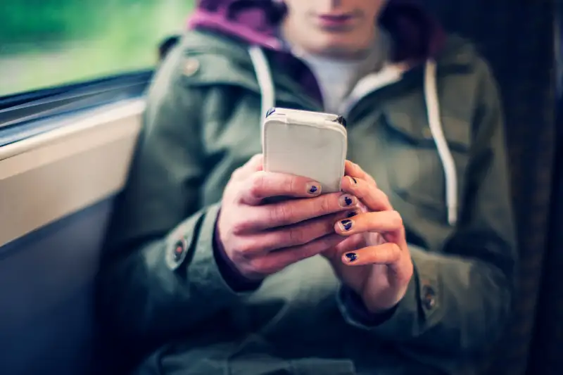 Teenage girl using a smart phone