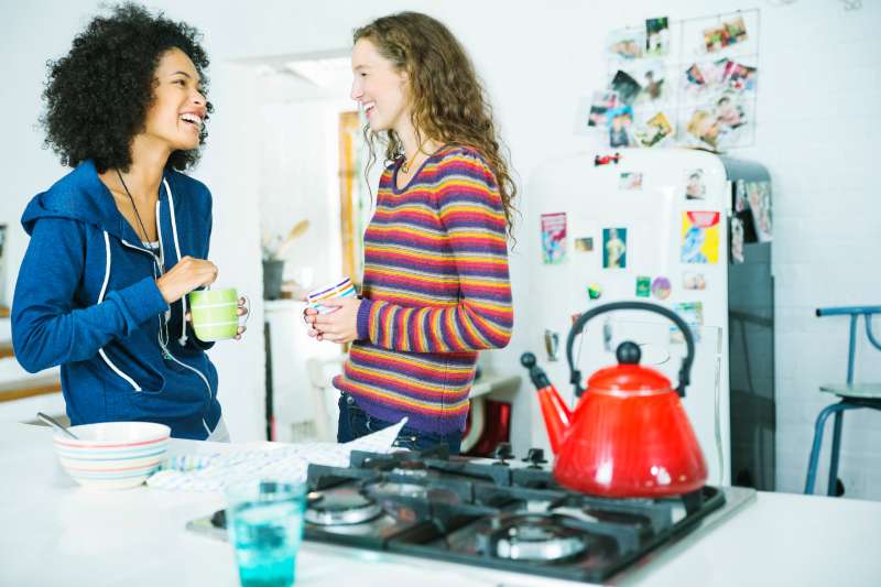 Women talking in kitchen