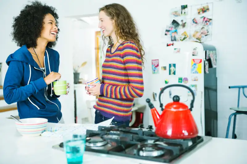 Women talking in kitchen