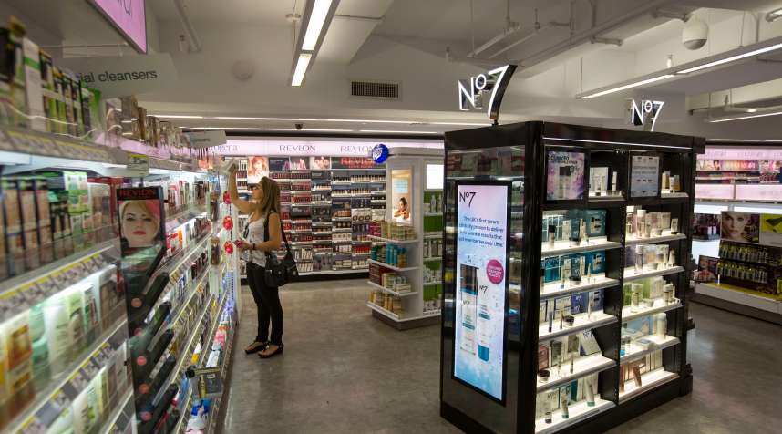 A woman browses products at a Walgreens store in New York. Women typically pay 7% more than men for similar products.
