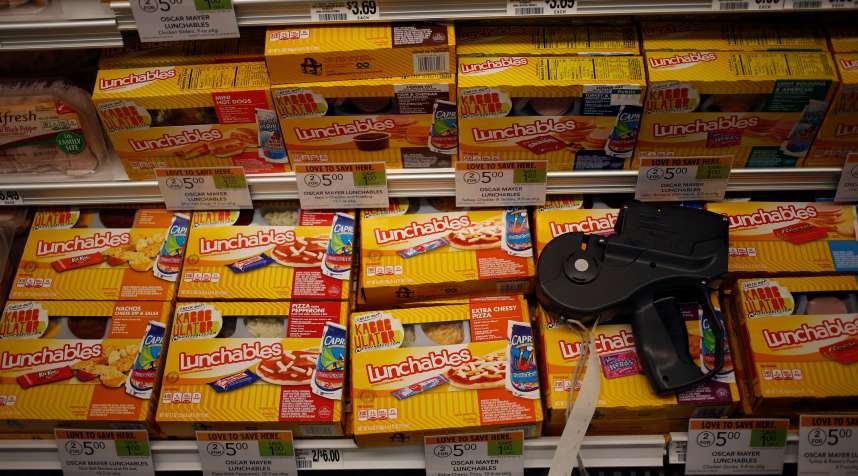 A price gun sits on top of packages of Oscar Mayer Co. Lunchables at a Publix Super Markets Inc. grocery store in Knoxville, Tennessee, U.S., on Wednesday, March 5, 2014. Publix's sales for the fourth quarter of 2013, were $7.4billion, a 5.3 percent increase from last year's $7.0 billion. Photographer: Luke Sharrett/Bloomberg via Getty Images