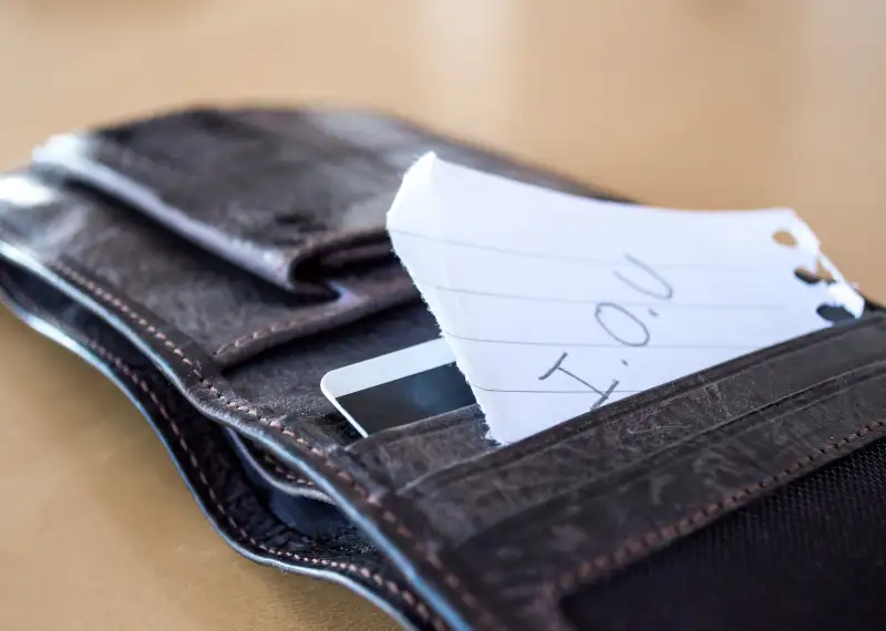 'I.O.U' Paper Message Inside a Leather Wallet