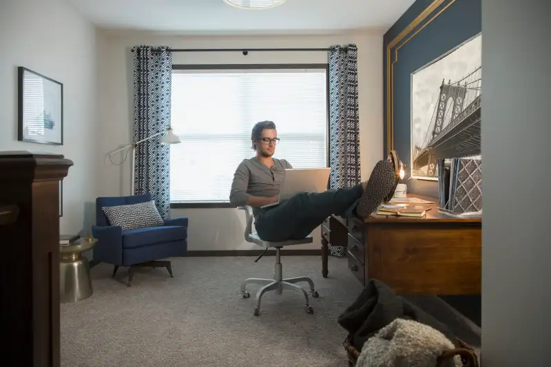 Man using laptop in home office