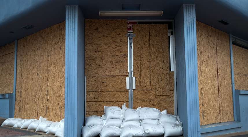 A storefront is barricaded with sandbags in Daytona Beach, Florida.