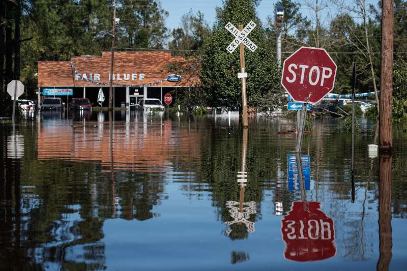 FAIR BLUFF, NC - OCTOBER 11: A roadway is flooded by remnants of Hurricane Matthew on October 11, 2016 in Fair Bluff, North Carolina. Thousands of homes have been damaged in North Carolina as a result of the storm and many are still under threat of flooding. (Photo by Sean Rayford/Getty Images)