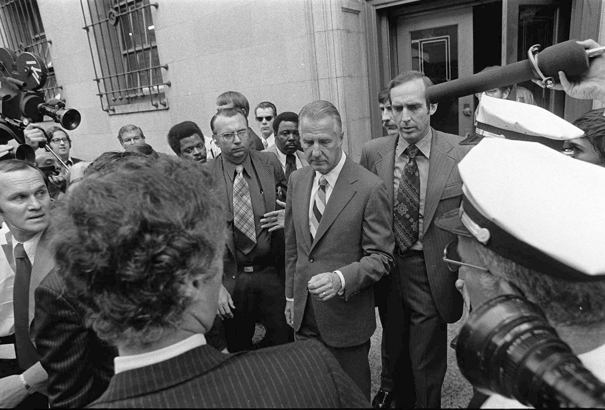 Spiro T. Agnew, center, is shown leaving court in Baltimore Oct. 10, 1973 after pleading no contest to a charge of income tax evasion. Agnew resigned from the Vice Presidency shortly after.