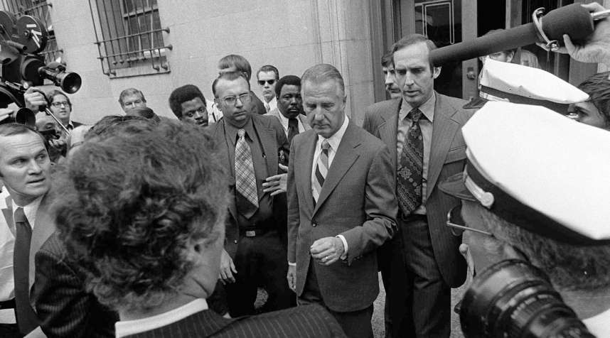 Spiro T. Agnew, center, is shown leaving court in Baltimore Oct. 10, 1973 after pleading no contest to a charge of income tax evasion.  Agnew resigned from the Vice Presidency shortly after.