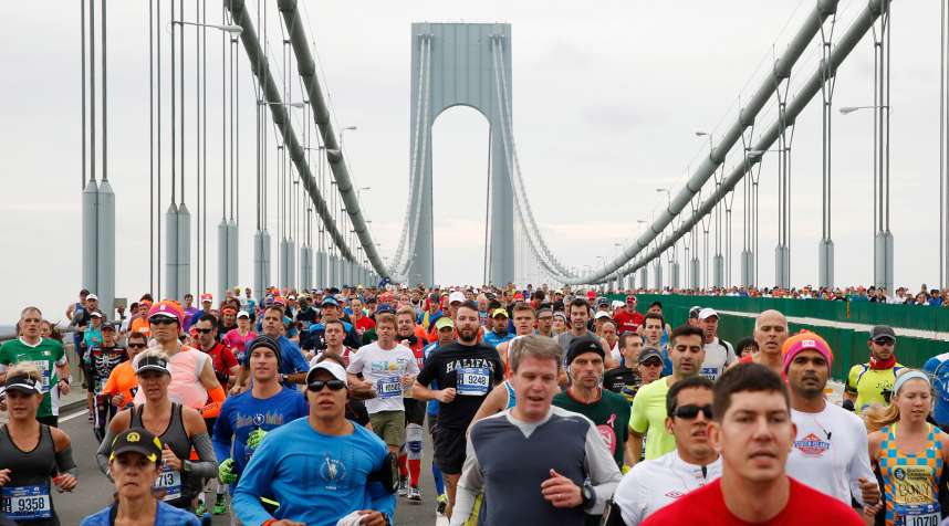 Runners cross the Verrazano-Narrows Bridge shortly after the start of the 2015 New York City Marathon.