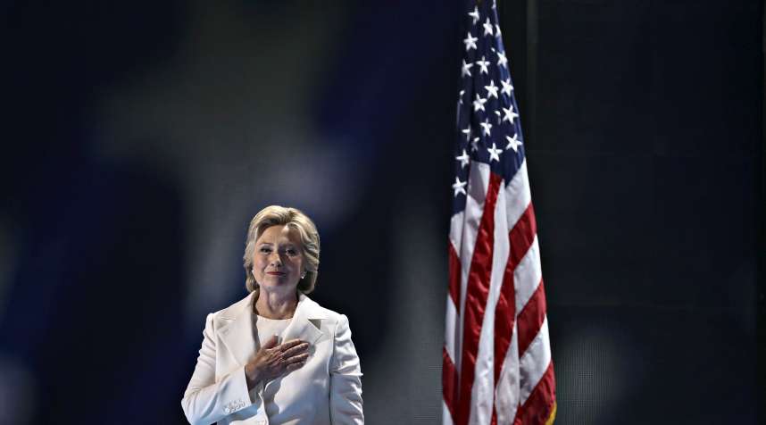 Hillary Clinton, 2016 Democratic presidential nominee, holds a hand over her heart while arriving to speak during the Democratic National Convention (DNC) in Philadelphia, Pennsylvania, U.S., on Thursday, July 28, 2016.