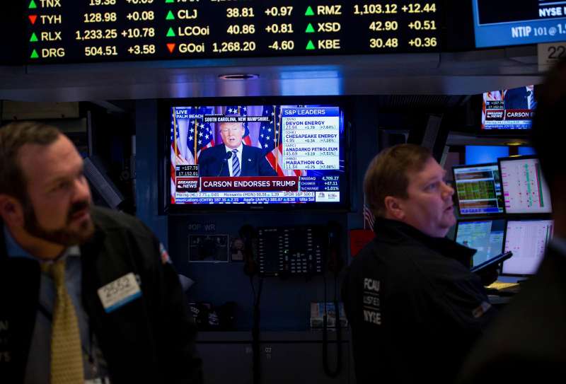 Donald Trump, president and chief executive of Trump Organization Inc. and 2016 Republican presidential candidate, is seen speaking on a monitor as traders work on the floor of the New York Stock Exchange (NYSE) in New York, U.S., on Friday, March 11, 2016.