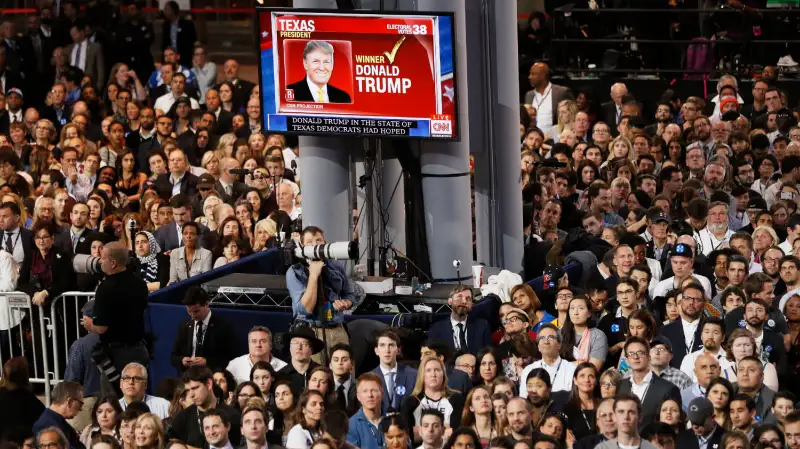 Supporters of Democratic U.S. presidential nominee Hillary Clinton watch election returns showing Donald Trump winning in Texas at the election night rally in New York on Nov. 8, 2016.