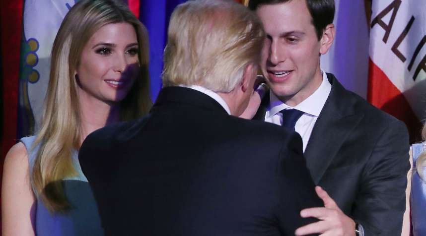 President-elect Donald Trump embraces son in law Jared Kushner (R), as his daughter Ivanka Trump, stands nearby.