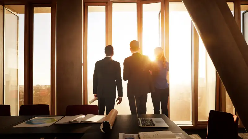 Co-workers observing the sunrise.