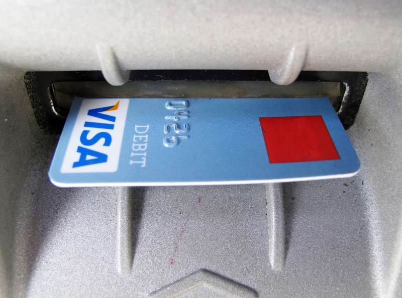A bank card is ejected from an ATM machine