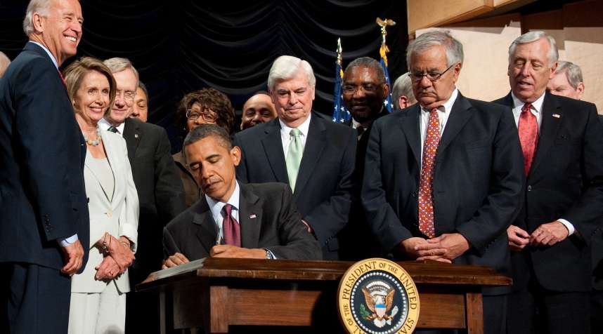 US President Barack Obama signs the Dodd-Frank Wall Street Reform and Consumer Protection Act alongside members of Congress in 2010.
