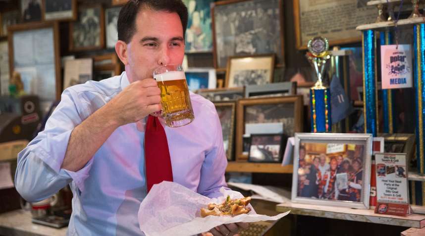 A rare instance of Wisconsin Gov. Scott Walker eating something other than a ham-and-cheese sandwich, while campaigning in 2015.