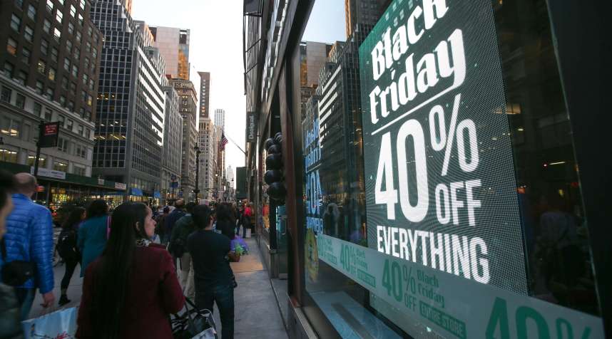 Shoppers are seen outside a shop on the first day of Black Friday in New York on November 27, 2015.