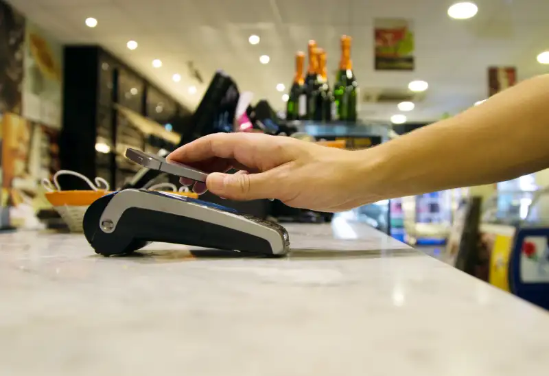 Man doing a contactless payment with smartphone application