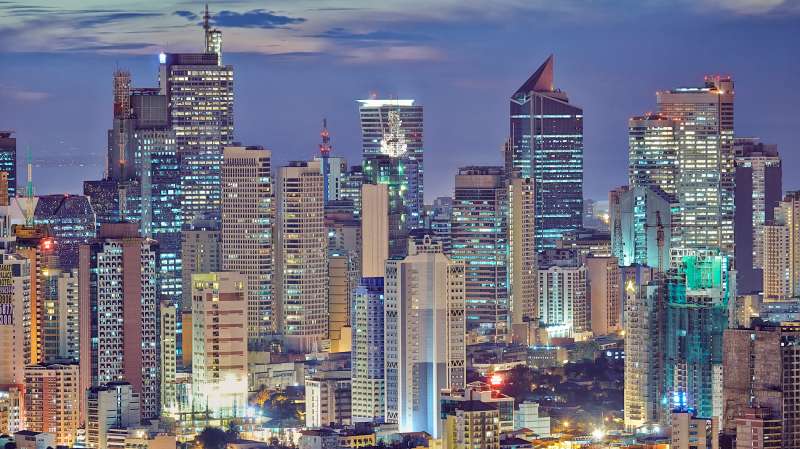 Asia, South East Asia, Philippines, Manila, Intramuros, view of Makati and the business district at dusk.
