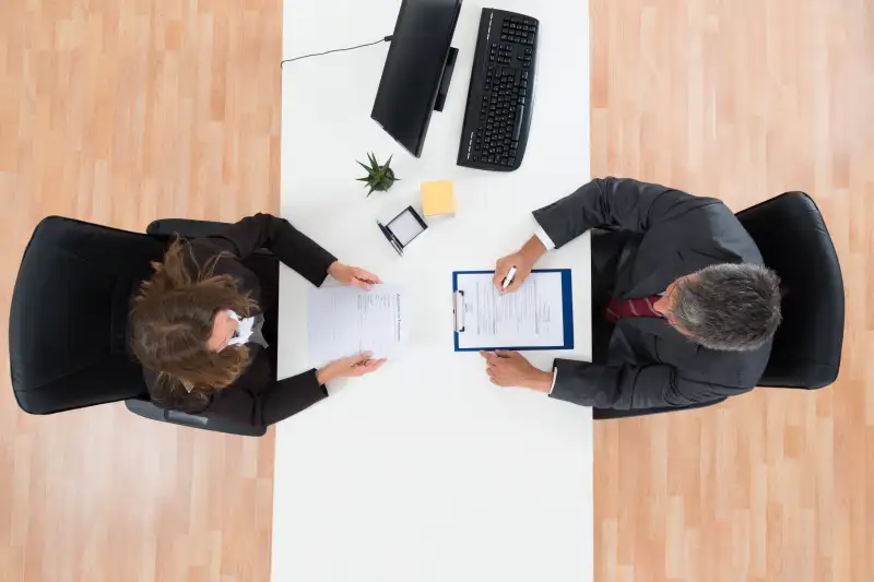 Businessman Interviewing Female Candidate