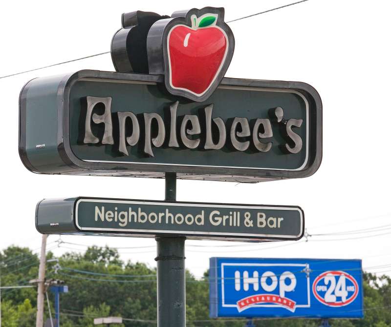 An Applebee's sign appears opposite an IHOP sign on Route 46