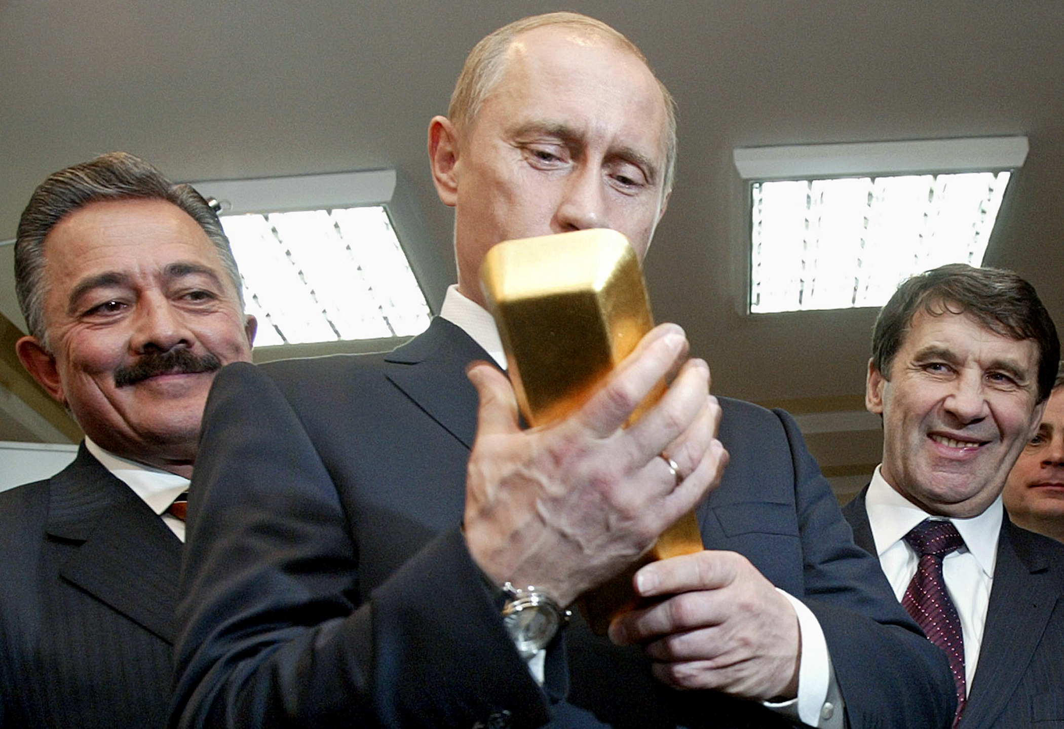 Putin Holding Bar of Gold