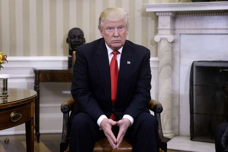 President-elect Donald Trump looks on in the Oval Office of the White House during a meeting with U.S. President Barack Obama on November 10, 2016.