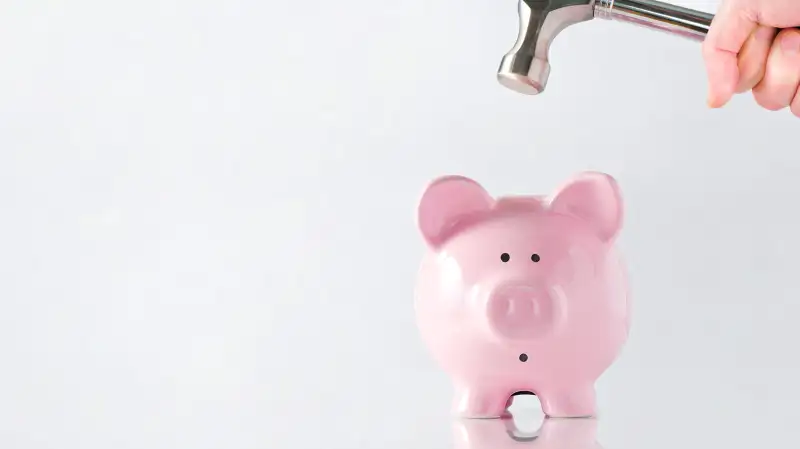 piggy bank hit with hammer