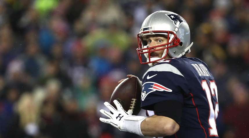 Tom Brady #12 of the New England Patriots looks to pass the ball against the Pittsburgh Steelers in the AFC Championship Game at Gillette Stadium on January 22, 2017 in Foxboro, Massachusetts.
