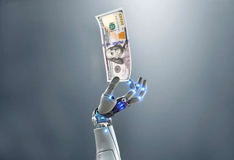 Robot hand holding money
