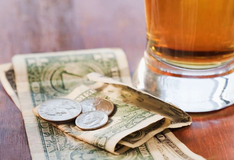 Glass of beer and money