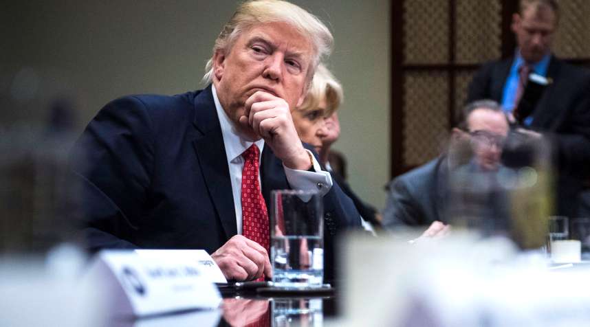 President Donald Trump listens during a meeting with county sheriffs in the Roosevelt Room of the White House in Washington, DC on Tuesday, Feb. 07, 2017.