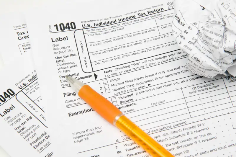 Tax forms with pen