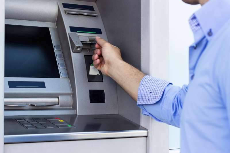Man using a ATM