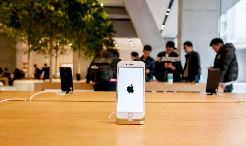 An iPhone 7 is exhibited in an Apple Store.  Because of the