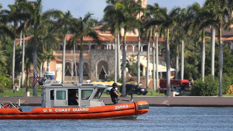 A U.S. Coast Guard boat passes in front of the Mar-a-Lago Resort where President-elect Donald Trump is staying as the 538 members of the Electoral College are set to make his election victory official on December 19, 2016 in Palm Beach, Florida.