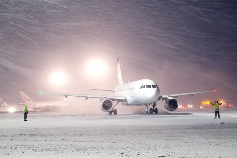 plane parked at the airport in winter